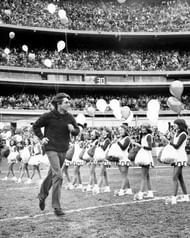 New York Jets' quarterback Joe Namath running onto the field during halftime ceremonies honoring 1969 Super Bowl champs.